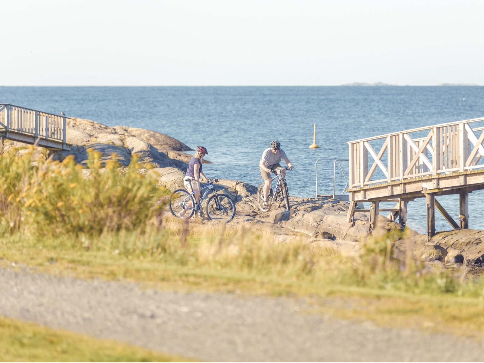 Couple biking along the coast in Telemark-Avia-Visit Telemark-norway-by-bike